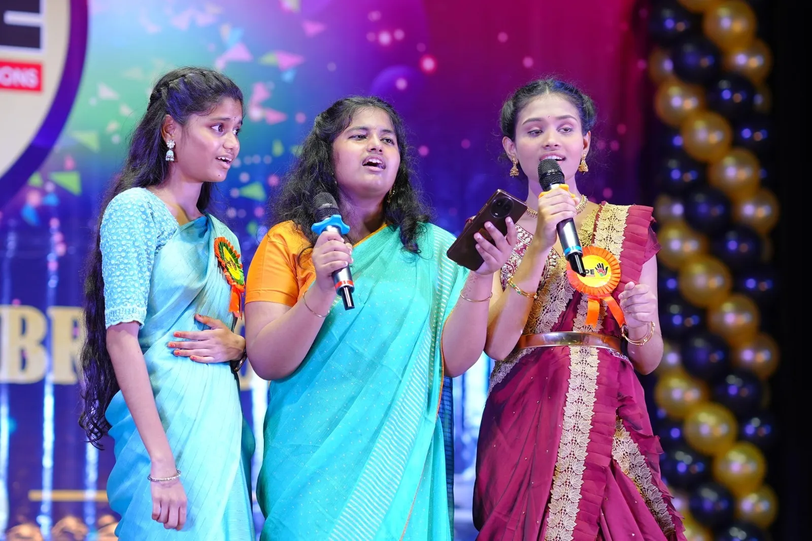 Student anchors on stage